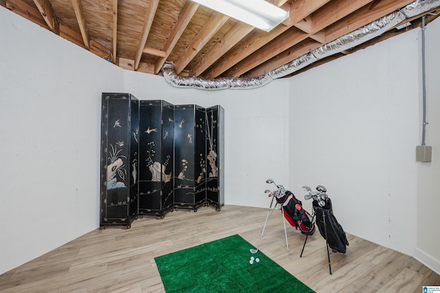 workout area with wood-type flooring