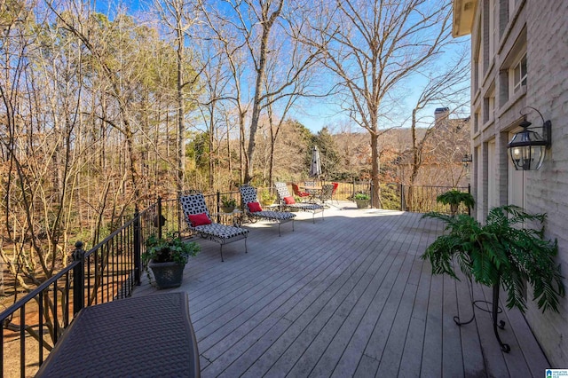 wooden terrace featuring a mountain view