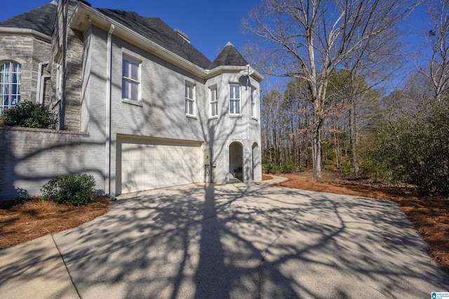 view of property exterior with a garage