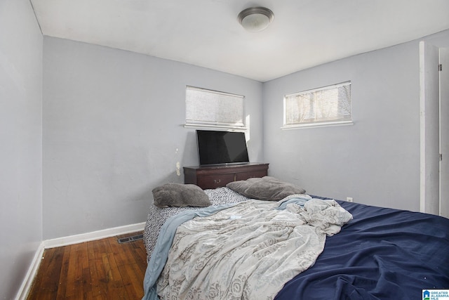 bedroom featuring dark wood-type flooring