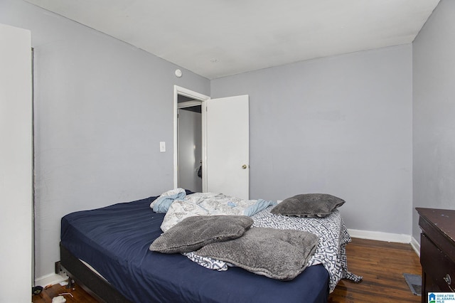 bedroom featuring dark wood-type flooring