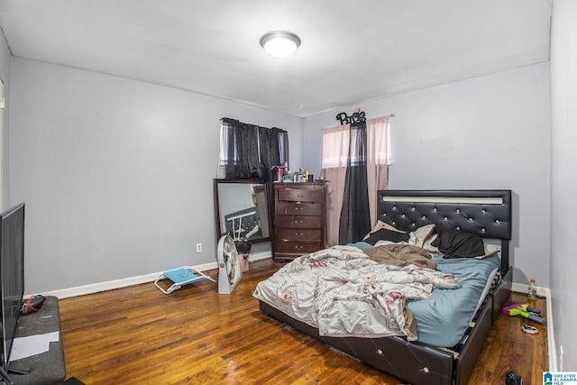 bedroom featuring wood-type flooring