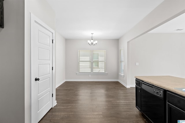 unfurnished dining area featuring an inviting chandelier and dark wood-type flooring