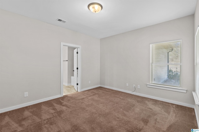 spare room featuring carpet floors