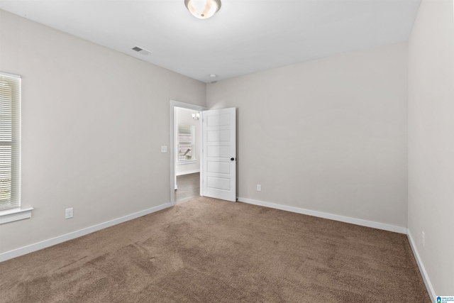 empty room with carpet flooring