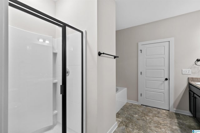 bathroom featuring vanity and shower with separate bathtub