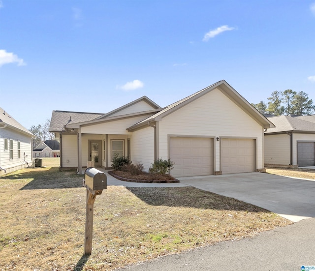 ranch-style home with cooling unit and a garage