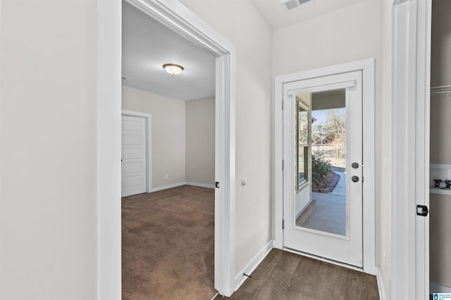 doorway to outside featuring dark wood-type flooring