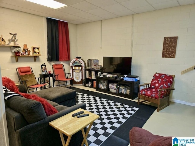 living room with a paneled ceiling