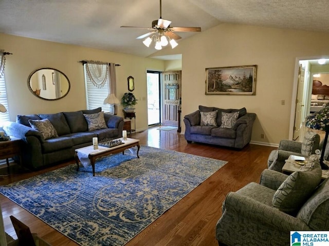 living room featuring ceiling fan, a textured ceiling, dark hardwood / wood-style flooring, and lofted ceiling