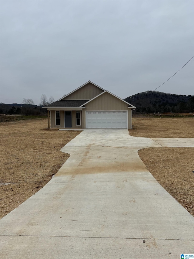 ranch-style home featuring a garage