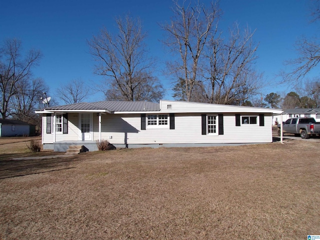 single story home with a front lawn, a porch, and a carport