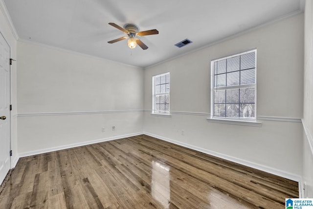 spare room featuring ceiling fan, crown molding, and hardwood / wood-style floors