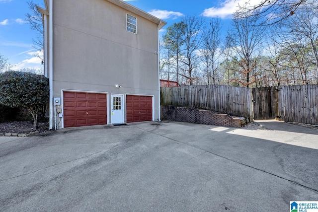 view of side of property with a garage