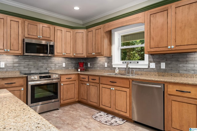 kitchen featuring decorative backsplash, sink, and stainless steel appliances