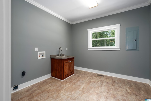 washroom with cabinets, sink, ornamental molding, hookup for a washing machine, and electric panel