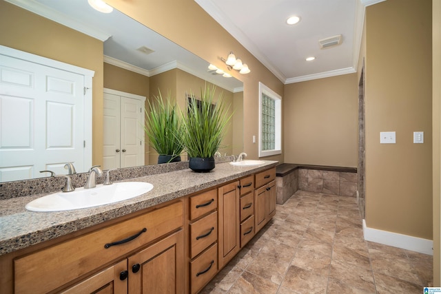 bathroom with ornamental molding and vanity