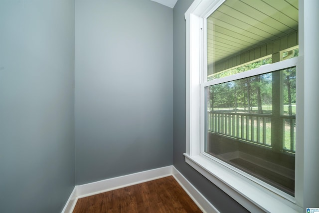 unfurnished room with dark hardwood / wood-style floors