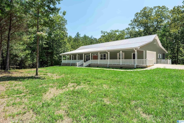 view of front of property with covered porch and a front lawn