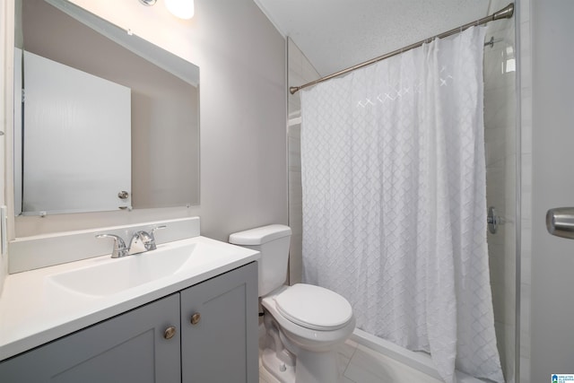 bathroom featuring toilet, vanity, and a shower with shower curtain