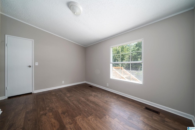 unfurnished room with a textured ceiling and dark hardwood / wood-style flooring