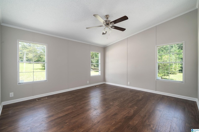 empty room featuring a textured ceiling, ornamental molding, and dark hardwood / wood-style flooring