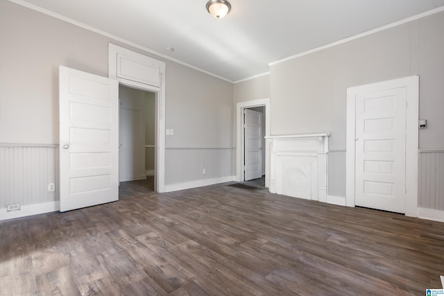 unfurnished bedroom featuring dark hardwood / wood-style flooring and crown molding