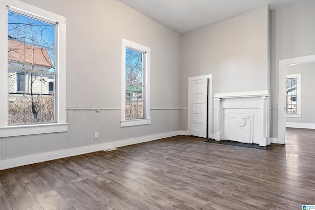 unfurnished room with dark wood-type flooring