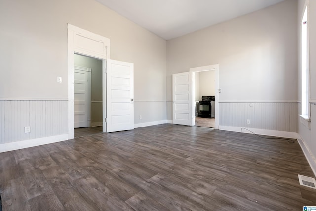 empty room featuring dark hardwood / wood-style flooring