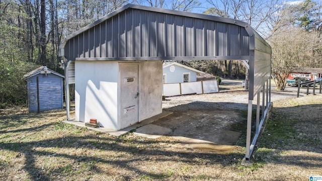 view of outbuilding with a carport