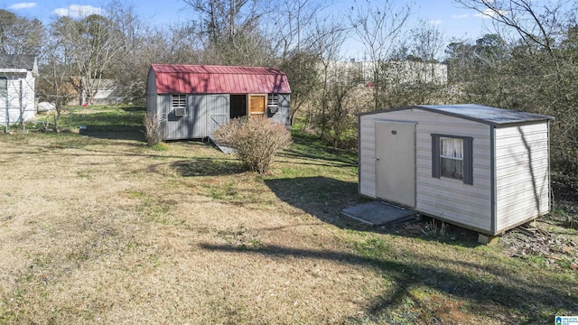 view of outdoor structure featuring a lawn