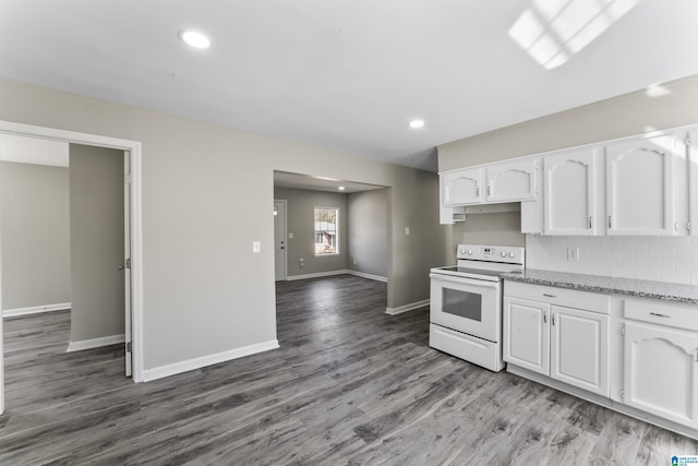 kitchen with hardwood / wood-style floors, white cabinets, electric range, and light stone countertops