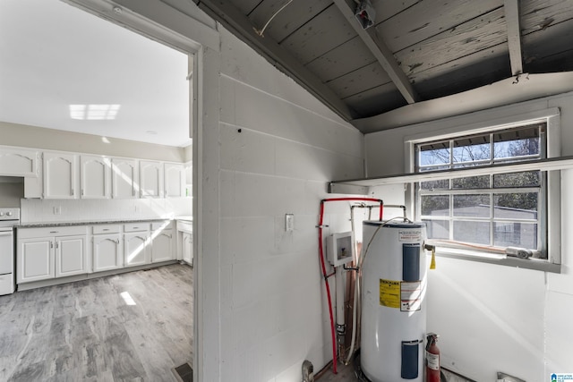 utility room featuring electric water heater