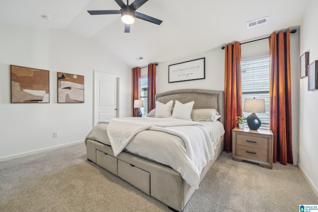 bedroom with ceiling fan, light carpet, and lofted ceiling