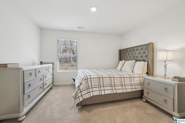 bedroom with light carpet