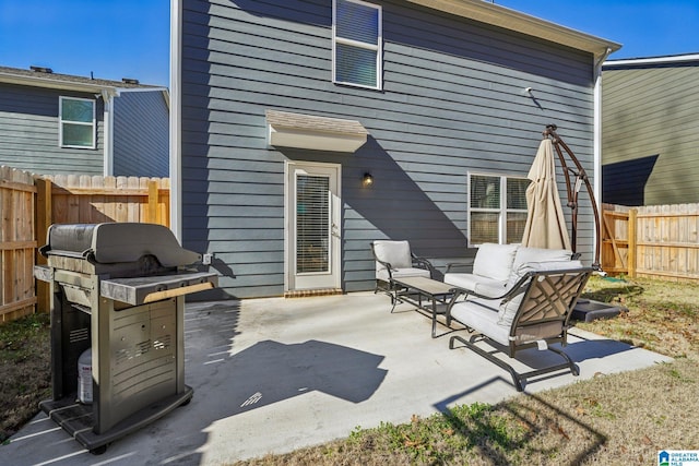 back of house featuring a patio area and an outdoor hangout area