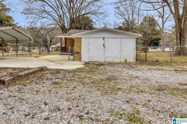 view of outbuilding with a carport