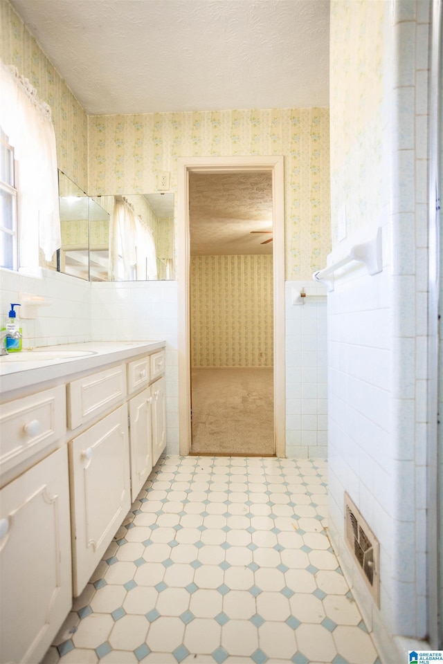 bathroom featuring vanity and a textured ceiling