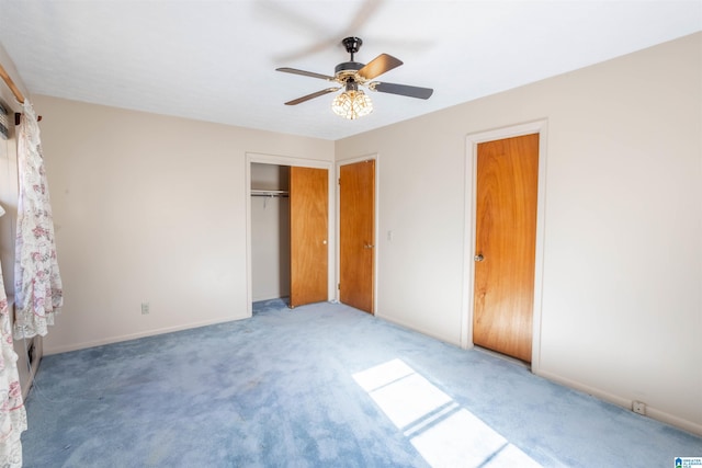 unfurnished bedroom with ceiling fan and carpet floors