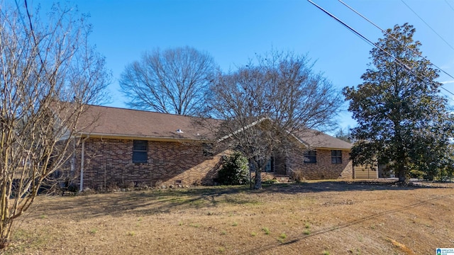 view of home's exterior with a lawn