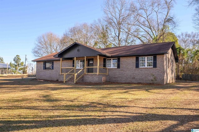 single story home with a front lawn and a porch