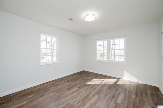 unfurnished room featuring hardwood / wood-style floors