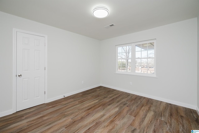 empty room featuring dark hardwood / wood-style floors