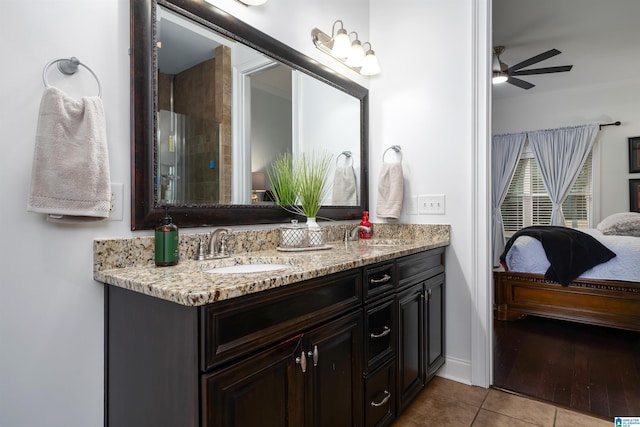 bathroom featuring tile patterned floors, ceiling fan, and vanity