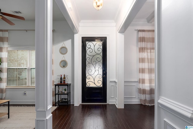 entryway featuring ceiling fan, dark wood-type flooring, and crown molding