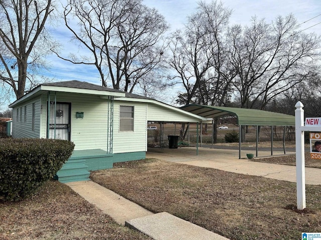 view of side of property with a carport