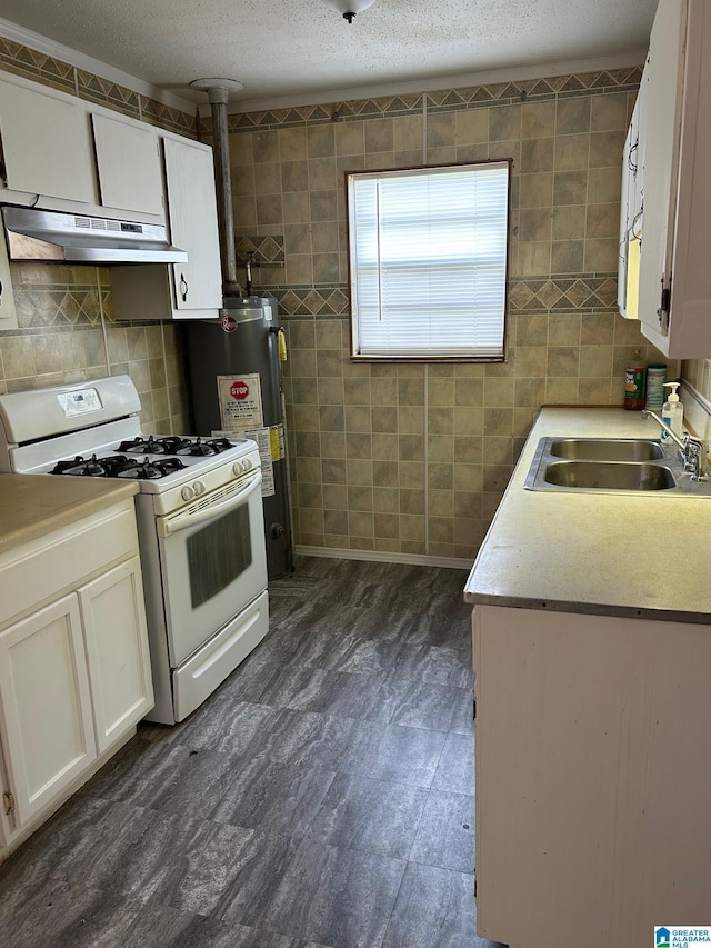 kitchen featuring sink, a textured ceiling, white gas range oven, water heater, and white cabinets