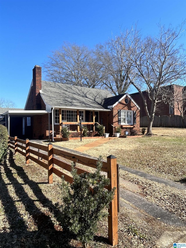 view of front of property featuring a carport