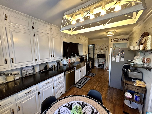 kitchen featuring sink, white cabinets, dark hardwood / wood-style flooring, and stainless steel appliances