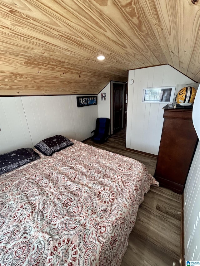 bedroom with dark wood-type flooring, wooden ceiling, lofted ceiling, and wooden walls